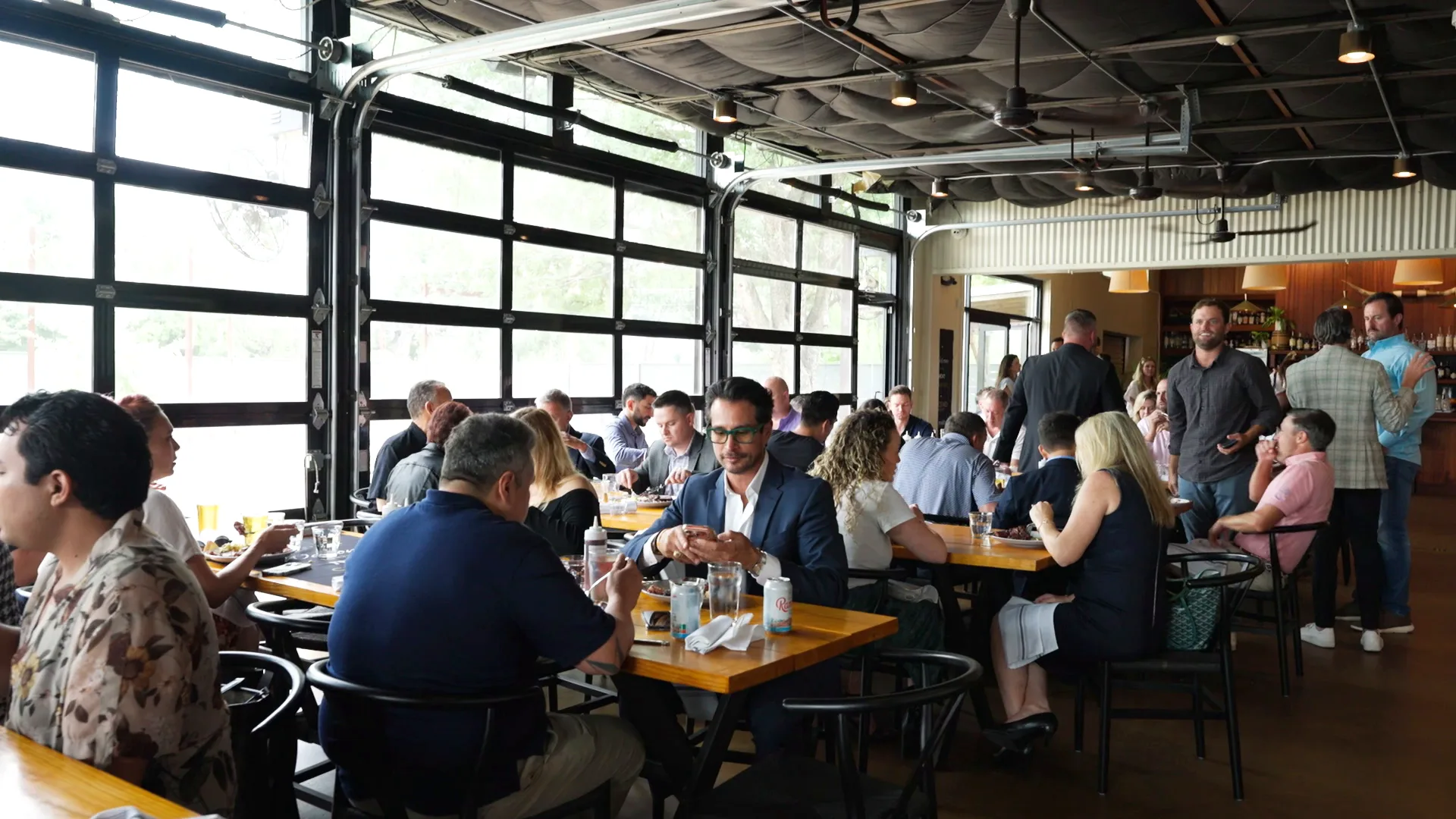 Ascend agents together at a team event at Franklin Barbecue Backyard in Austin